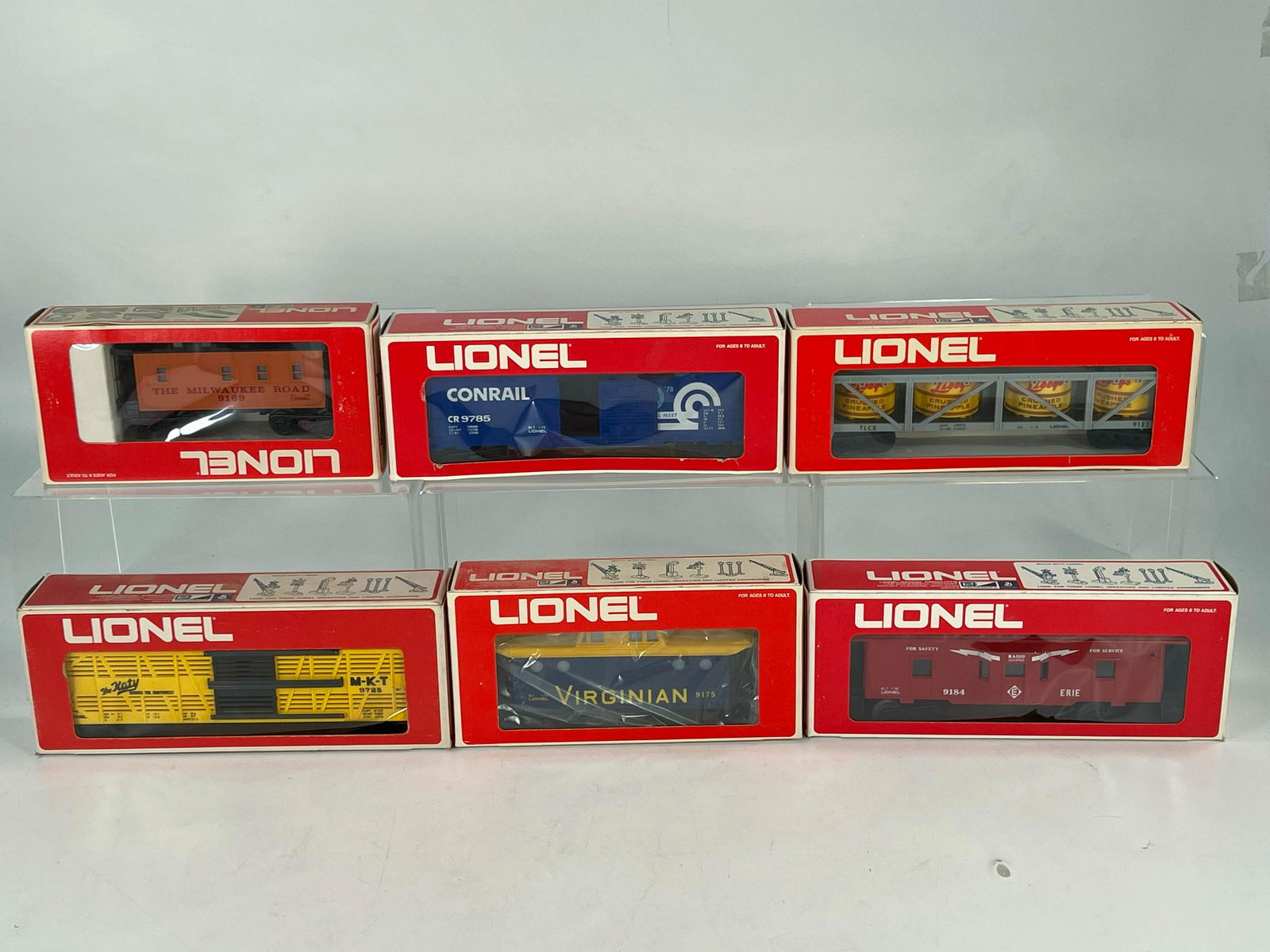 MPC Lionel O Gauge Freight Cars in Original Boxes X 6: MPC Lionel O Gauge Freight Cars in Original Boxes X 6, including MKT Cattle Car, Virginian Lighted Caboose, Erie Bay Window Caboose, Milwaukee Road Illuminated Caboose, Conrail Box Car and Libby's Pin