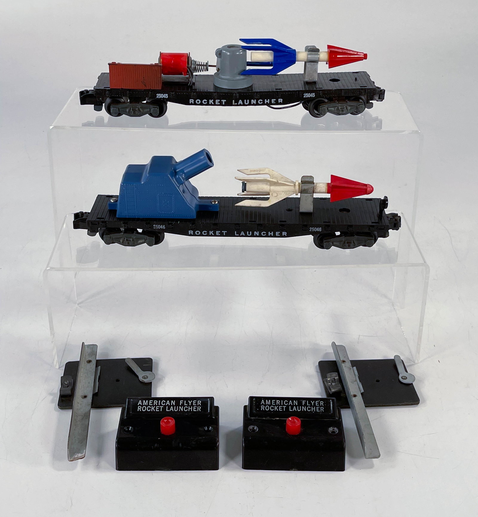 American Flyer S Gauge by Gilbert #25045 Rocket: American Flyer S Gauge by Gilbert #25045 Rocket Launching Car and #25046 Rocket Launching Car, both original rockets and both have original buttons and track trips, both in overall C6.