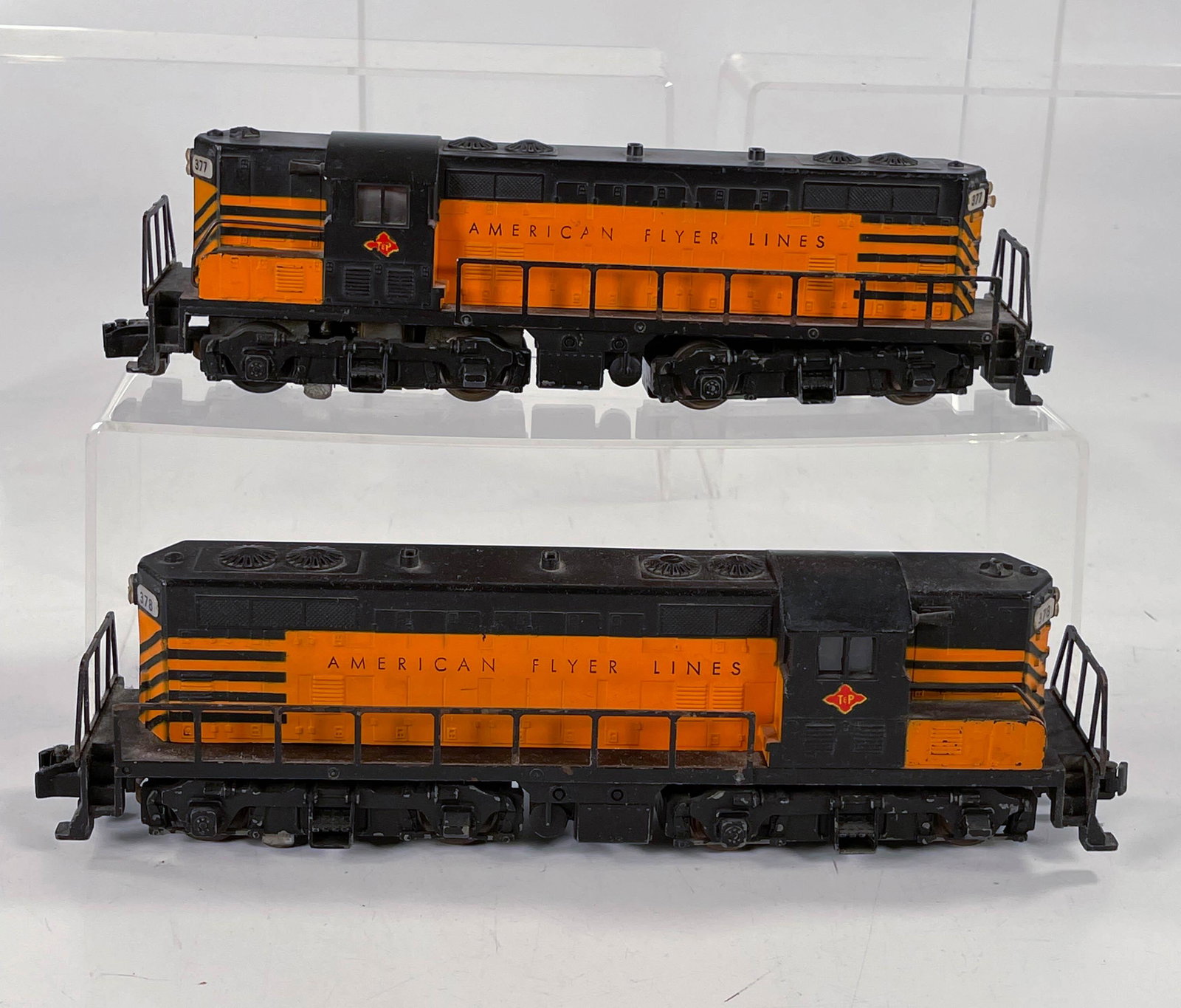 American Flyer S Gauge by Gilbert #377 and #378 AA: American Flyer S Gauge by Gilbert #377 and #378 AA Texas and Pacific Diesel Units, One Powered and One Non-Powered, in overall C7 with a minute portion of a decal missing on one of the units.