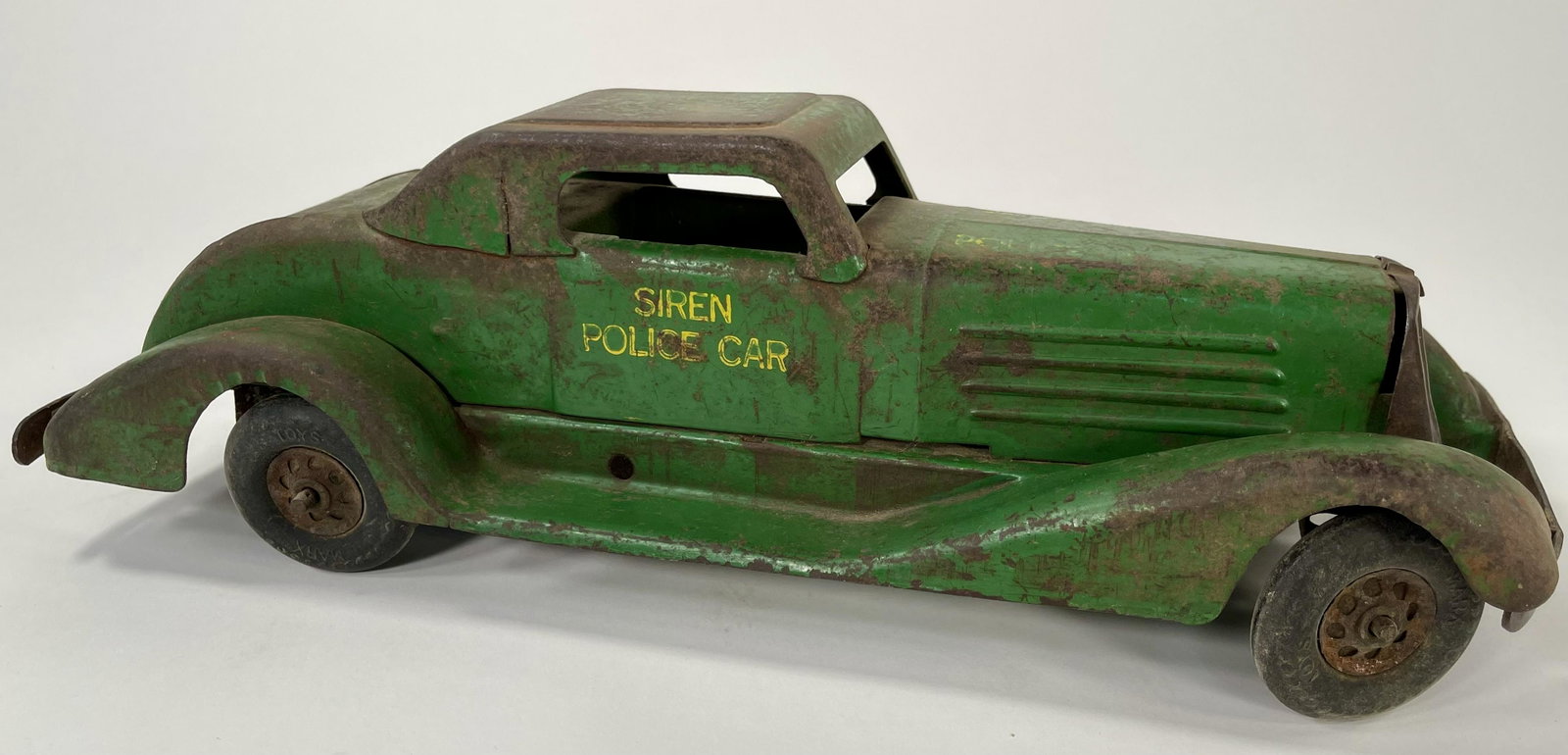 Marx Green Police Car: Marx Green Police Car Coupe, approx. 11" long and moderate playwear.