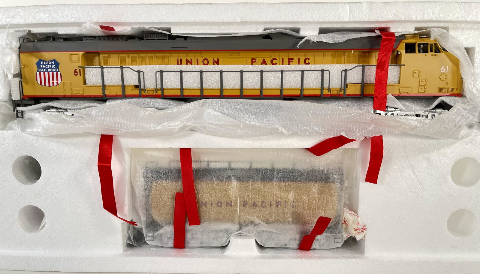 MTH O Gauge Union Pacific Veranda Diesel with Tender in: MTH O Gauge Union Pacific Veranda Diesel with Tender in Original Styrofoam packing, in C10 factory new. This item missing its original box.