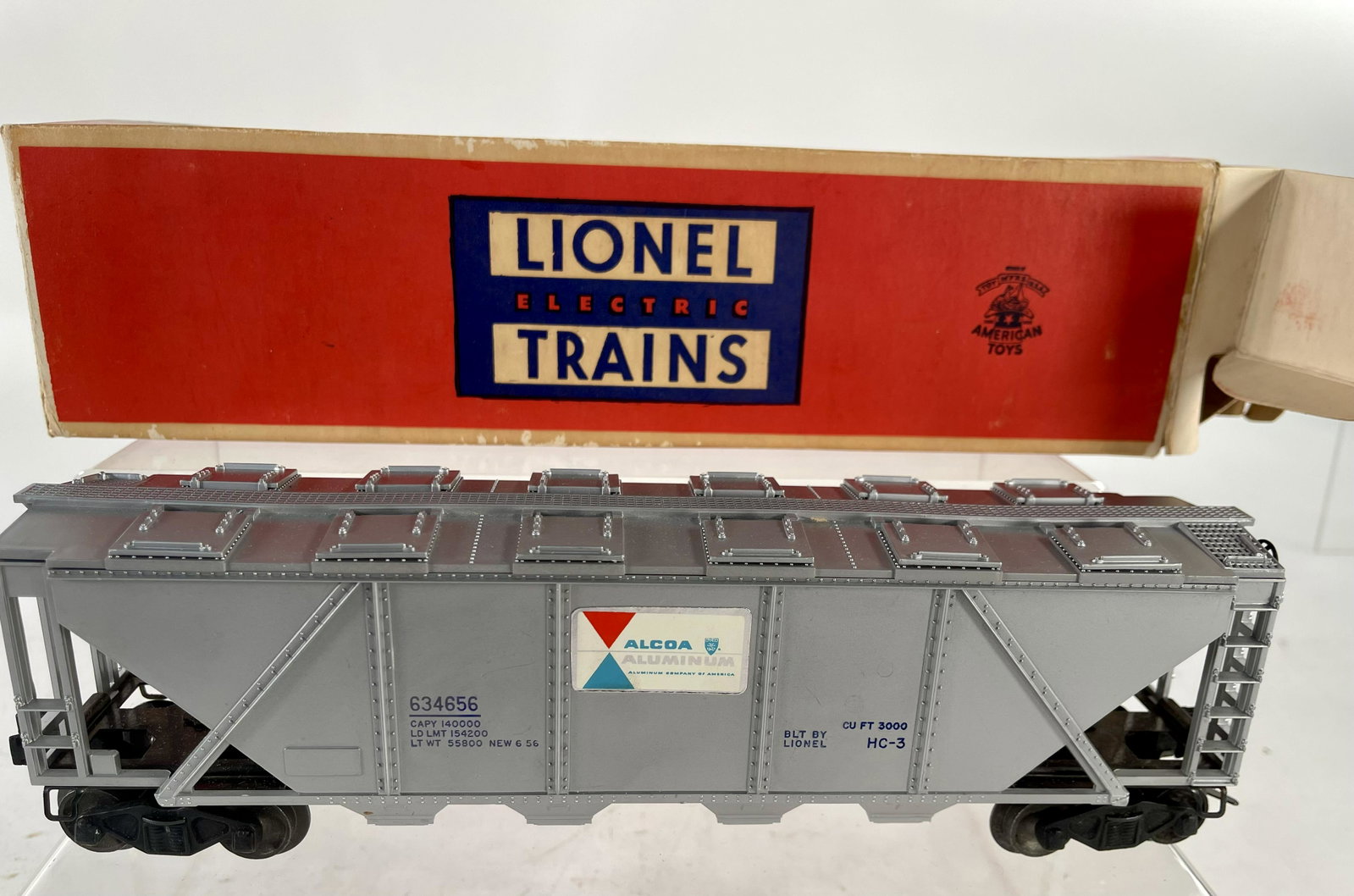 Postwar Lionel O Gauge 6346 Alcoa Covered Hopper with: Postwar Lionel O Gauge 6346 Alcoa Covered Hopper with Blue Lettering in Original Box, with fantastic silver/blue lettering in C9/C10 condition, with Original Box having box repairs to flaps on one end