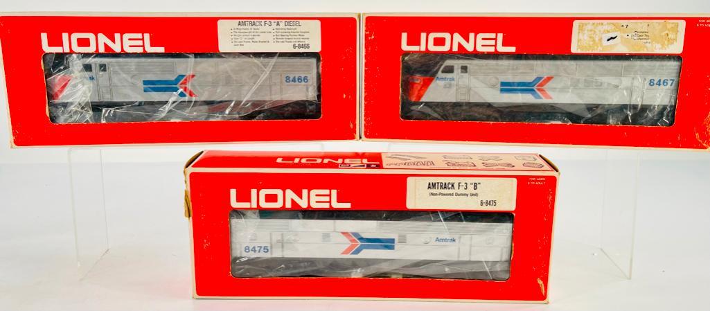 New Lionel Amtrak F – 3 A Diesel #6 – 8466, 8467 and Amtrak F – 3 B Unit #6 –: New Lionel Amtrak F – 3 A Diesel #6 – 8466, 8467 and Amtrak F – 3 B Unit #6 – 8475, all boxed and in overall C9.