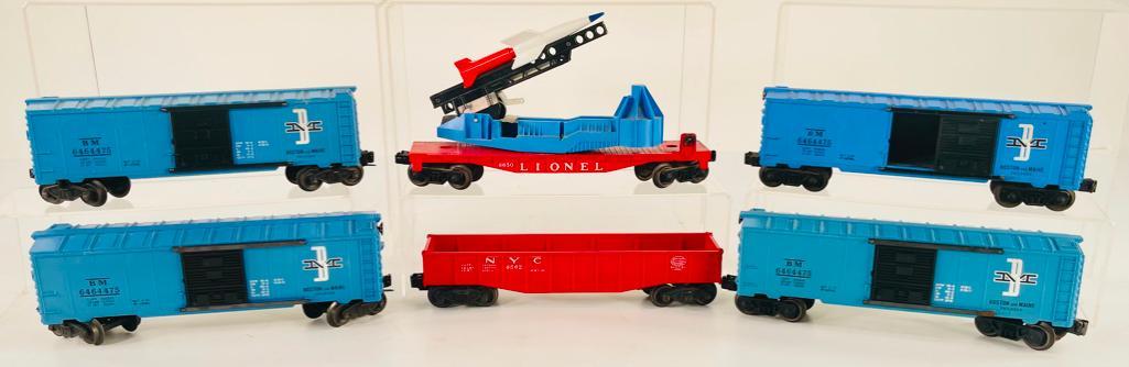 Lionel Postwar 6650 Rocket Car and 6464 – 475 Boston & Maine Box Car X4 and 6562 N.Y.C. Red (1 of 4)