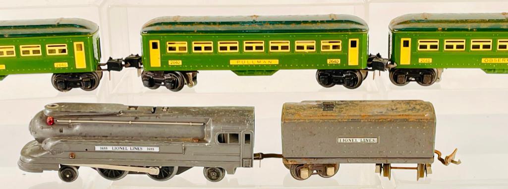 Lionel Prewar O Gauge 1688 Gray Loco with Gray Tender with 2640, 2640 and 2641 Green Passenger Cars: Lionel Prewar O Gauge 1688 Gray Loco with Gray Tender with 2640, 2640 and 2641 Green Passenger Cars, with all these items in C5 overall because of the rust appearing on the roofs from moisture.