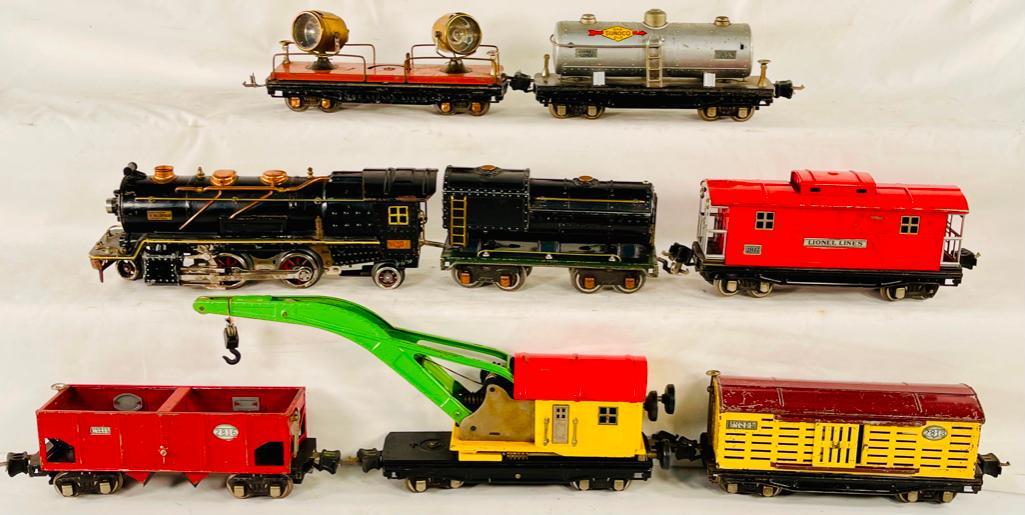 Lionel Prewar O Gauge 260E Loco Black Loco and Tender with Six (6) Assorted Freight Cars: Lionel Prewar O Gauge 260E Loco Black Loco and Tender with Six (6) Assorted Freight Cars, including 260E Black cream stripe loco with 260T vandy tender, both in C6 minus, with a 2820 floodlight car in