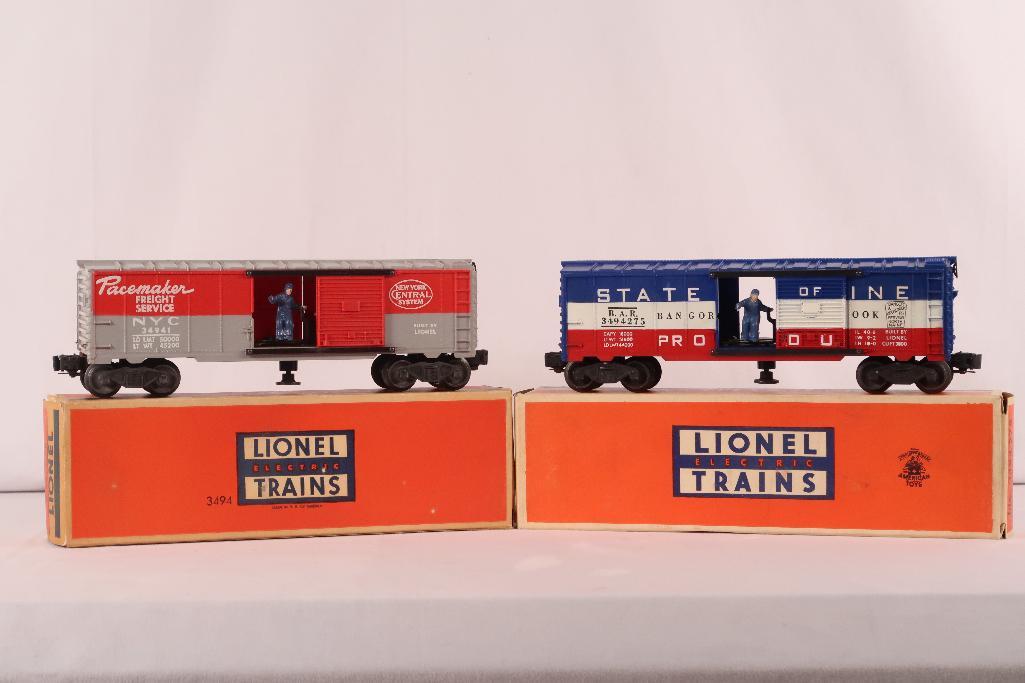 Lionel Postwar 3494 - 275 Operating Box Car and 3494 Operating Box Car: Lionel Postwar 3494 - 275 Operating Box Car and 3494 Operating Box Car, including 3494 in C7 with its original box and 3494 - 275 in C7 with its original box.