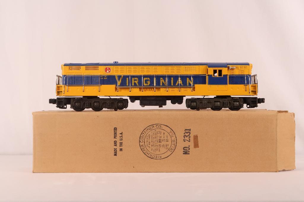 Lionel Postwar 2331 Yellow and Blue Virginian FM: Lionel Postwar 2331 Yellow and Blue Virginian FM, in C7/C7 plus with faint screw hole crack at one end. Includes its original box.