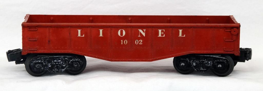 Lionel Postwar 1002 Red Brown Gondola: Lionel Postwar 1002 Red Brown Gondola, in C7. This is a rare car and hard to locate in this condition. Went with the Magnetraction layout.