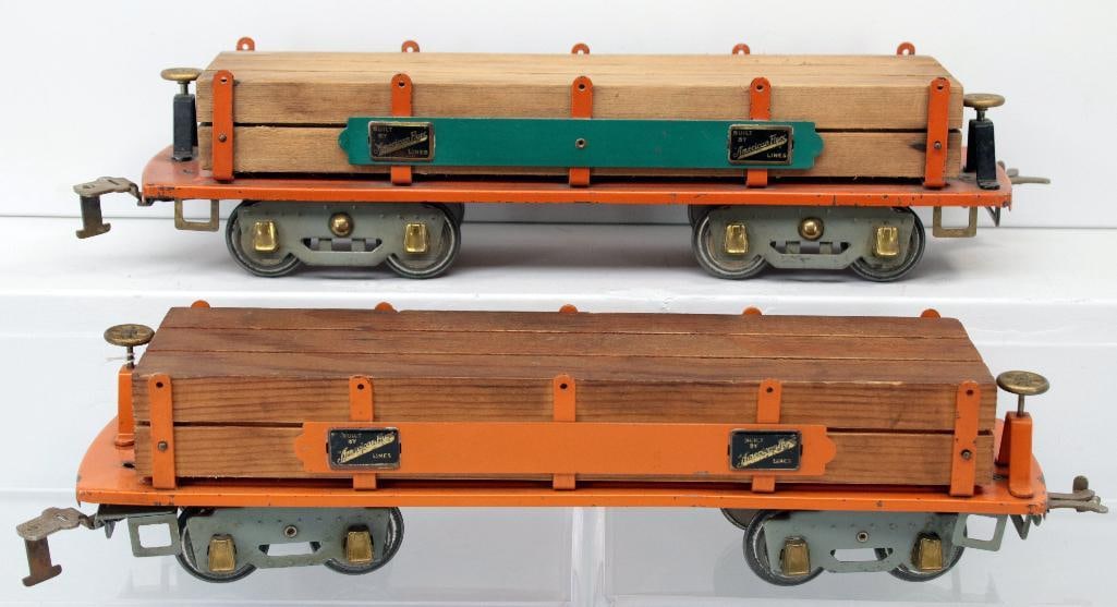 American Flyer Prewar Wide Gauge 4023 orange Lumber Car and 4023 green and orange Lumber Car: American Flyer Prewar Wide Gauge 4023 orange Lumber Car and 4023 green and orange Lumber Car, with the 4023 orange Lumber Car with load in C7 plus and 4023 orange Lumber Car with green sidings and ori