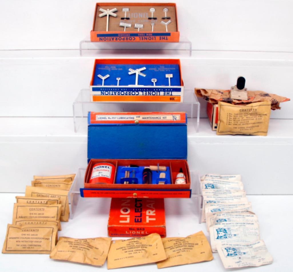 Lionel Postwar O Gauge 480 - 25 Magnetic Coupler Conversion Unit Packet X11/943 Exploding Ammunition: Lionel Postwar O Gauge 480 - 25 Magnetic Coupler Conversion Unit Packet X11/943 Exploding Ammunition/2980 Magnetic Conversion Coupler Packet X10/148 Dwarf Signal/ 308 Railroad Sign Set/309 Yard Set/92