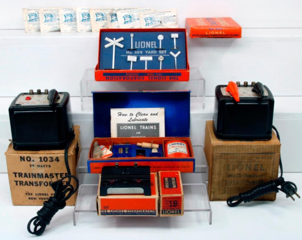 Lionel Postwar O Gauge Assorted Accessories and Packets: Lionel Postwar O Gauge 167 Whistle Controller/927 Lubricating and Maintenance Kit/309 Yard Set/943 Exploding Ammunition Dump/Lockons/480 Magnetic Conversion Coupler X8/ 1034 Transformer X2/operating p