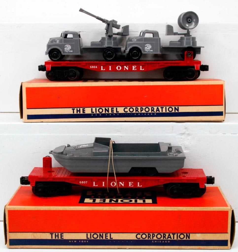 Lionel Postwar O Gauge 6807 Flat Car with Pyro Military Units and 6804 Flat Car with Pyro Military: Lionel Postwar O Gauge 6807 Flat Car with Pyro Military Units and 6804 Flat Car with Pyro Military Units, each in C7 or better overall condition and each with its original box. Gun Turret may be a rep