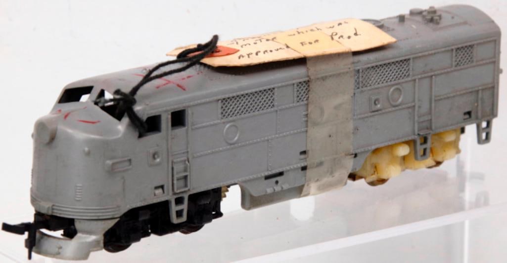 Marx Toy Trains HO Gauge Unmarked Diesel Powered A Unit Factory Prototype: Marx Toy Trains HO Gauge Unmarked Diesel Powered A Unit Factory Prototype, in C6 overall condition, with factory markings on the piece including a date of 3 - 29 - 57. The tag that is scotch taped on