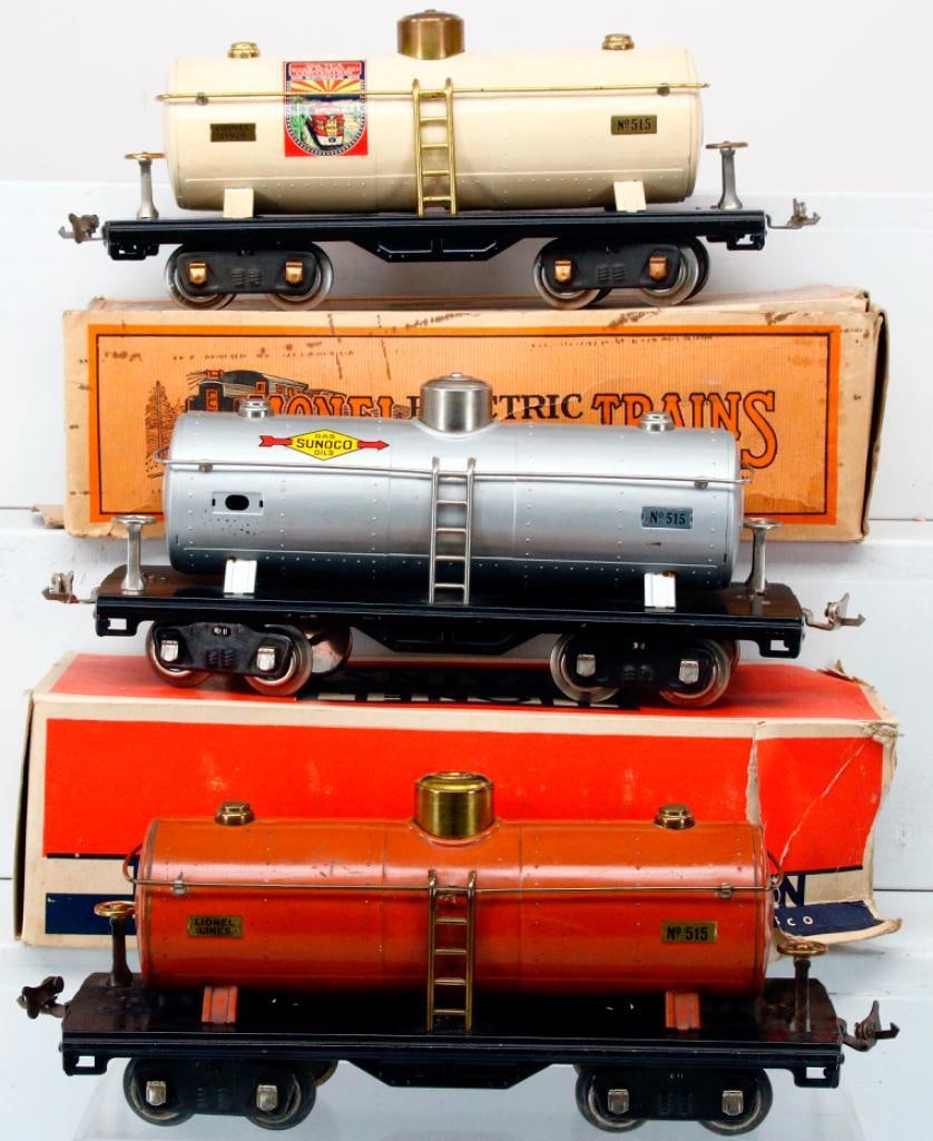 Lionel Prewar Standard Gauge 515 Tank Car X3: Lionel Prewar Standard Gauge 515 Tank Car X3, including 515 white Tank Car with TCA Convention Decal in C7, a 515 Silver Sunoco Tank Car in C7 and missing one of the Lionel Lines number boards on the 