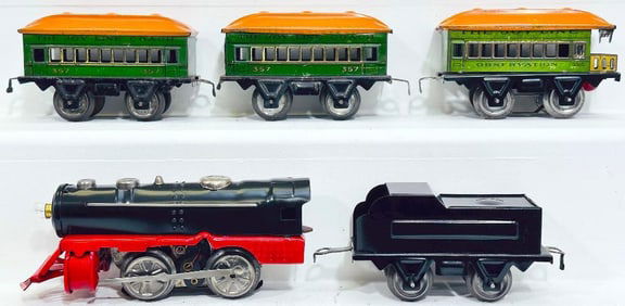 Joy Line Prewar O Gauge 0 –4–0 red and black Locomotive and black Tender with Three