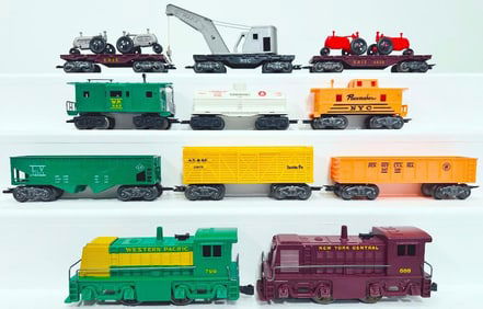 Marx Postwar O Gauge Nine (9) Assorted 8 wheel Plastic Freight Cars and 799 Western Pacific Switcher