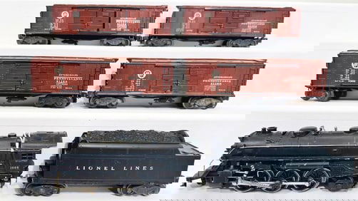 Lionel Postwar O Gauge 1666 Locomotive and 2466WX Tender and Four (4) Assorted Freight Cars