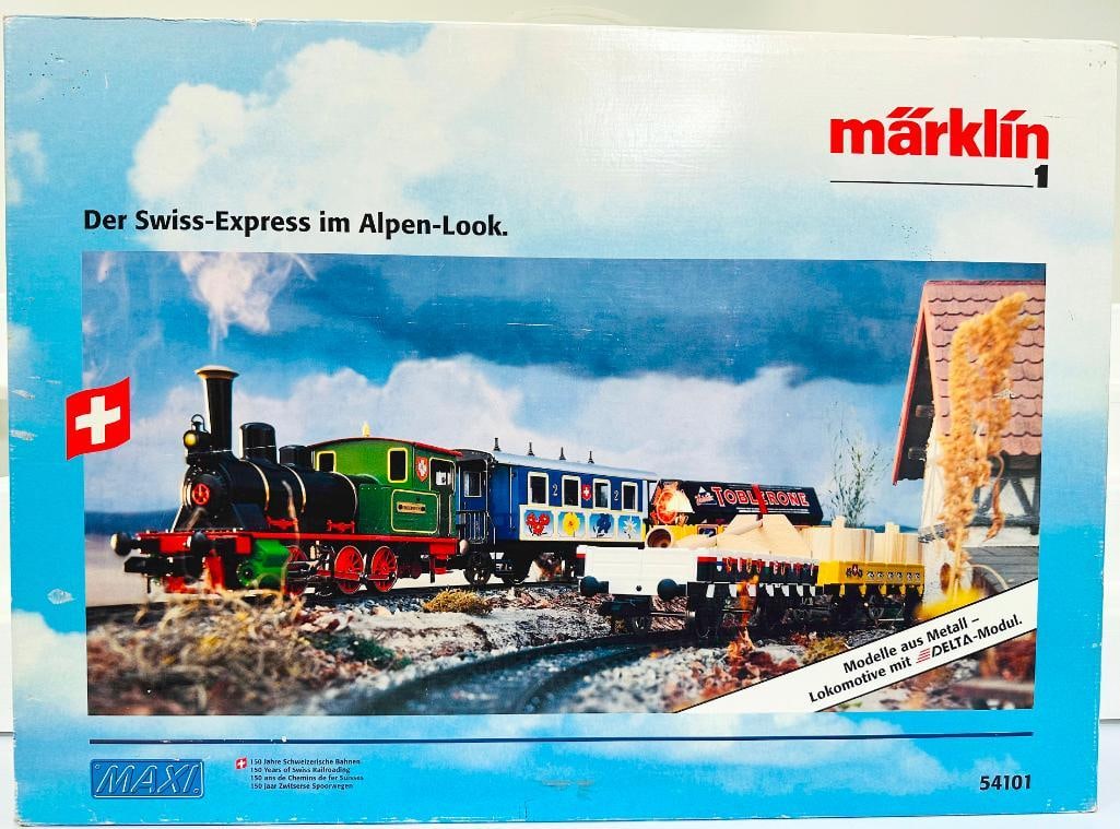Marklin Modern 1 Gauge 54101 Swiss Express Model Train Set Boxed: Marklin Modern 1 Gauge 54101 Swiss Express Model Train Set Boxed, in C8 to C9 and with its original box. This is a vintage down steam locomotive with steam, Swiss markings and colorful detailing; a Pa