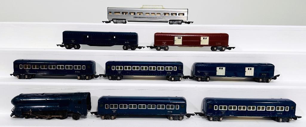 American Flyer Prewar O Gauge 556W Royal Blue Locomotive and Assorted Passenger Cars: American Flyer Prewar O Gauge 556W Royal Blue Locomotive and Assorted Passenger Cars, with the 556 Royal Blue Locomotive, in C5 with broken wheels, and also including 495 blue Passenger Car, in C6 plu