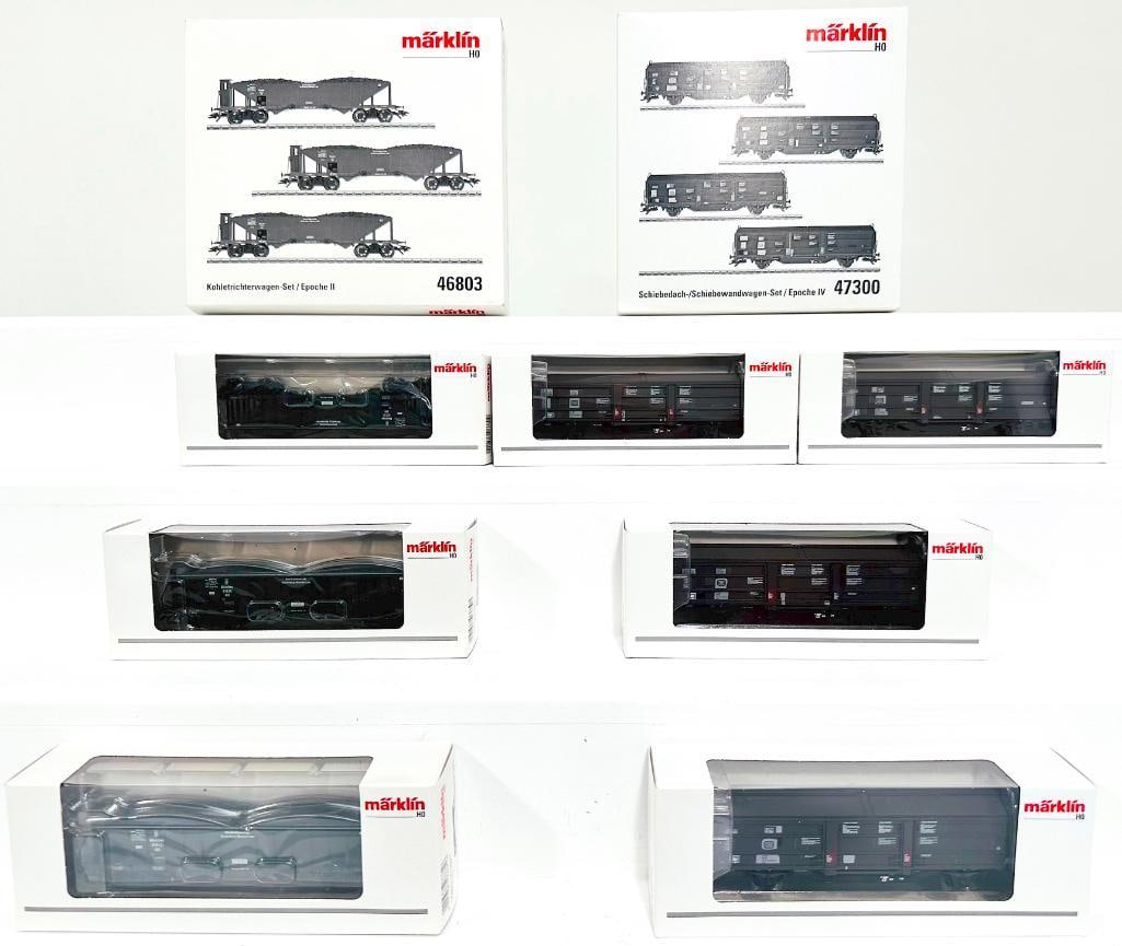 Marklin Modern HO Scale 3 Car Coal Hopper Set #46803 and 4 Car Sliding Wall Car Set #47300: Marklin Modern HO Scale 3 Car Coal Hopper Set #46803 and 4 Car Sliding Wall Car Set #47300, each in C9 and each with its original box.