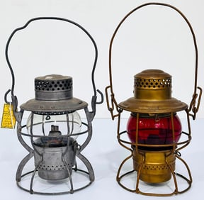 Adams and Westlake Co. gold colored lantern with red globe and NYCS gas lantern with clear globe