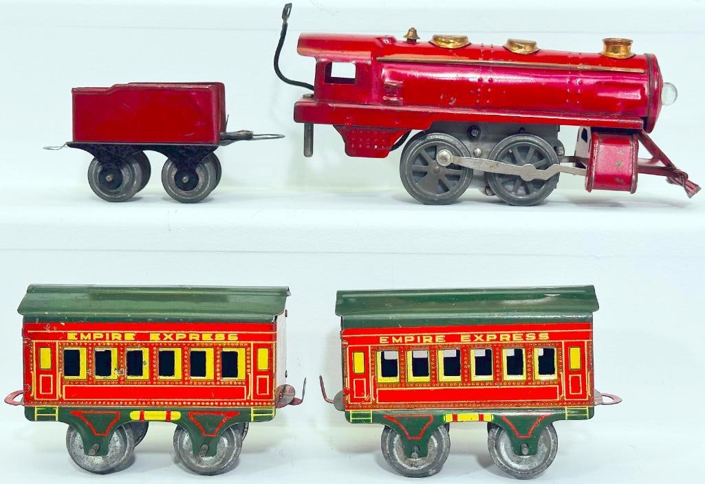 American Flyer Prewar O Gauge red Locomotive and red Tender with Empire Express Passenger Car X2: American Flyer Prewar O Gauge red Locomotive and red Tender with Empire Express Passenger Car X2, with the red Locomotive and Tender, each in C6 plus or better, and the Empire Express Passenger Car X2