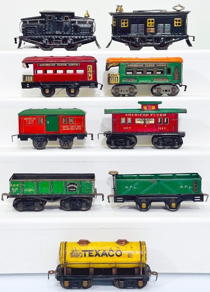 American Flyer Prewar O Gauge 3011 Black Electric Locomotive/1218 black Electric Locomotive/7 Cars: American Flyer Prewar O Gauge 3011 Black Electric Locomotive/1218 black Electric Locomotive and Seven (7) Assorted Freight Cars/Passenger Cars, with the 3011 in C6, the 1218 in C6 minus and each of th