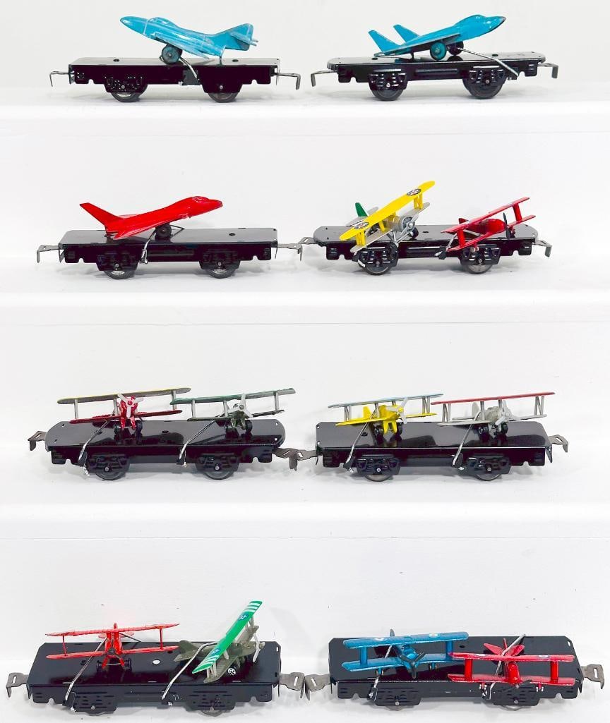 Marx Postwar O Gauge Eight (8) Assorted Flat Cars with airplane loads: Marx Postwar O Gauge Eight (8) Assorted Flat Cars with airplane loads, each in C6 plus to C7.