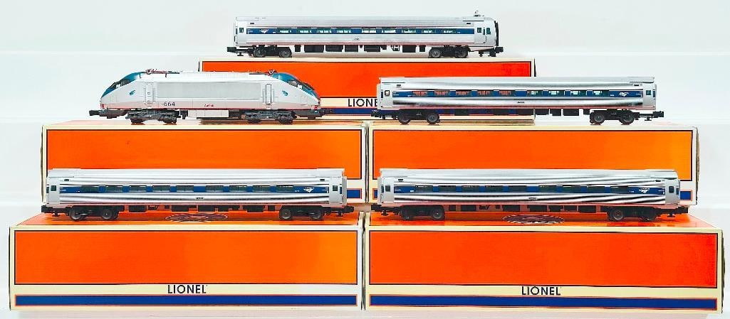 Lionel Modern O Gauge Amtrak Amfleet Cab Car - Amtrak Coach Car - Amtrak HHP - 8 Electric Locomotive: Lionel Modern O Gauge Amtrak Amfleet Cab Car - Amtrak Coach Car - Amtrak HHP - 8 Electric Locomotive - Amtrak Coach Car - Amtrak Coach Car Boxed, each in C9 and each with its original box.