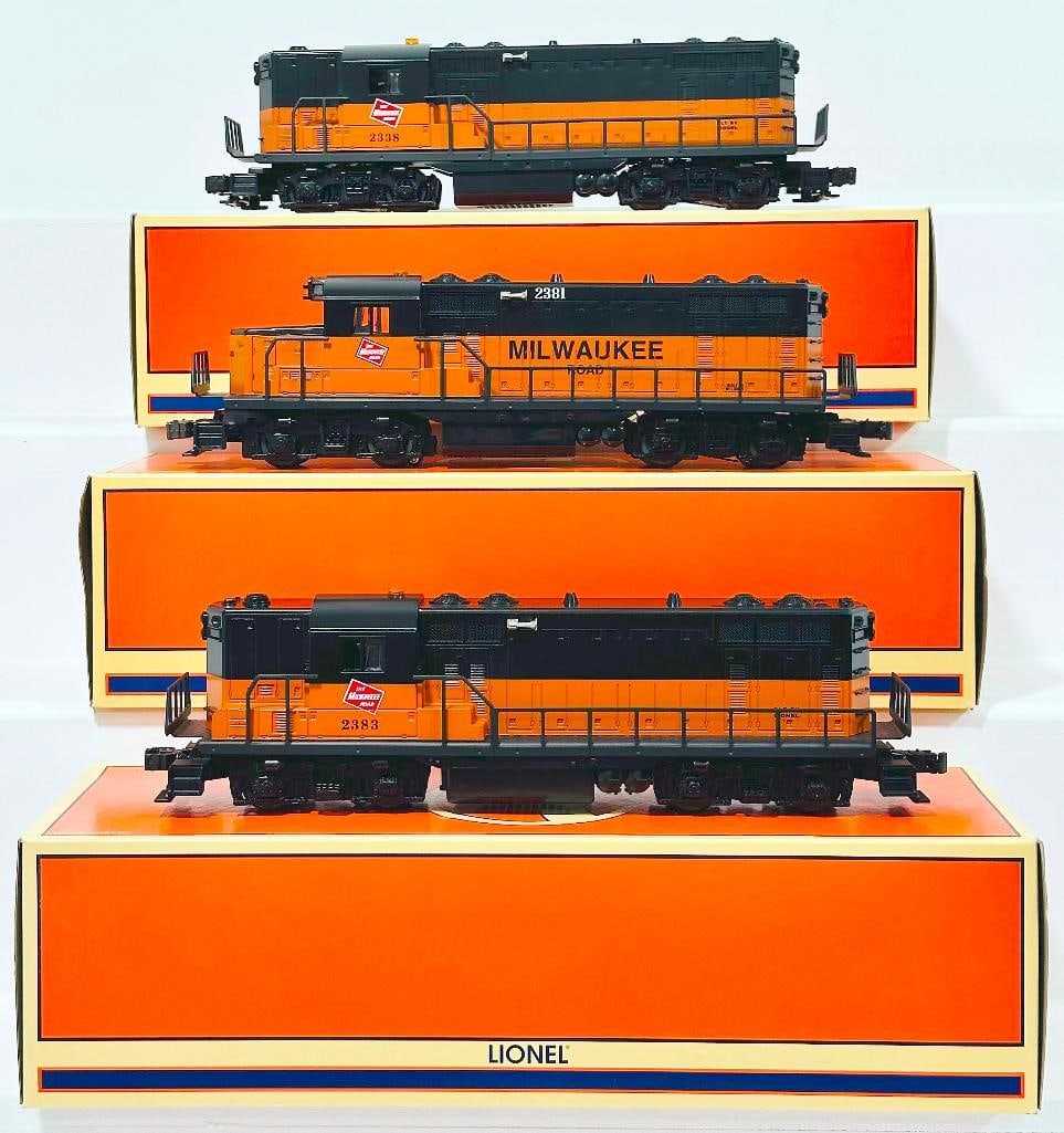 Lionel Modern O Gauge Milwaukee Road GP - 20 Diesel Locomotive/Milwaukee Road GP - 9 Diesel Switcher: Lionel Modern O Gauge Milwaukee Road GP - 20 Diesel Locomotive/Milwaukee Road GP - 9 Diesel Switcher/2338 Milwaukee Road GP - 9 Diesel Locomotive Boxed, each in C9 and each with its original box.