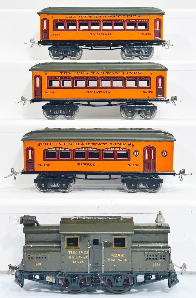 Ives Prewar O Gauge 3253 Olive Green Electric Locomotive and 129?129?130 orange/green roof Cars: Ives Prewar O Gauge 3253 Olive Green Electric Locomotive and 129 - 129 - 130 orange/ green roof Passenger Cars, with the 3253 in C7 and each of the Passenger Cars in C7 plus.