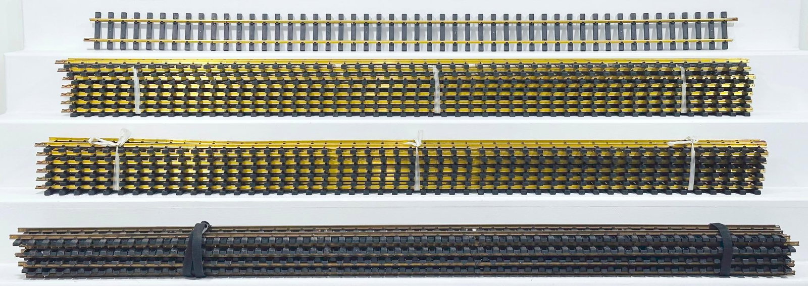 USA Trains/Aristo Craft Modern G Scale 58 inches on sections of Straight Track X 22: USA Trains/Aristo Craft Modern G Scale 58 inches on sections of Straight Track X 22, in C7 to C8 overall condition approximately 8 sections are C7. The longest item in this Lot is 60 inches.