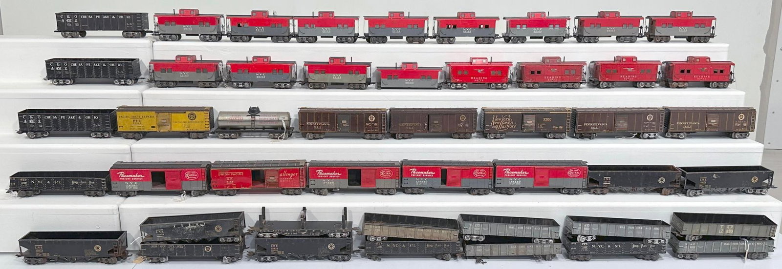 Marx Prewar and Postwar O Gauge 8 Wheel Cabooses-8 Wheel Box Cars-8 Wheel Gondolas-8 Wheel Hoppers: Marx Prewar and Postwar O Gauge 8 Wheel Cabooses - 8 Wheel Box Cars - 8 Wheel Gondolas - 8 Wheel Hoppers, each in C6 to C7. Due to the size and volume of this Lot, it will be costly to ship. There