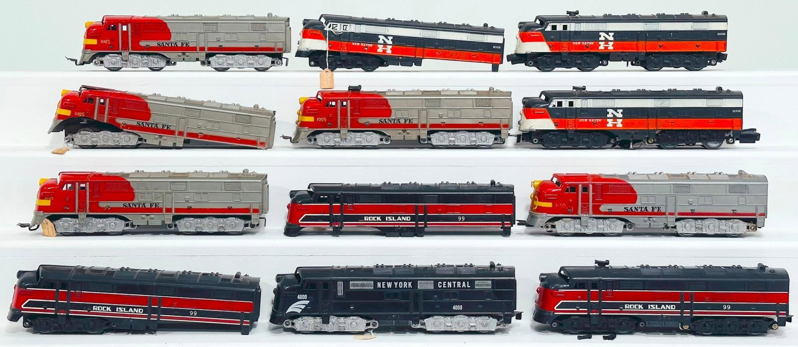 Marx Postwar O Gauge Assorted Santa Fe - Rock Island - New York Central - New Haven Diesel Units: Marx Postwar O Gauge Assorted Santa Fe - Rock Island - New York Central - New Haven Diesel Units - some missing wheel sets, each in C6 to C7. Due to the size and volume of this Lot, it will be costly