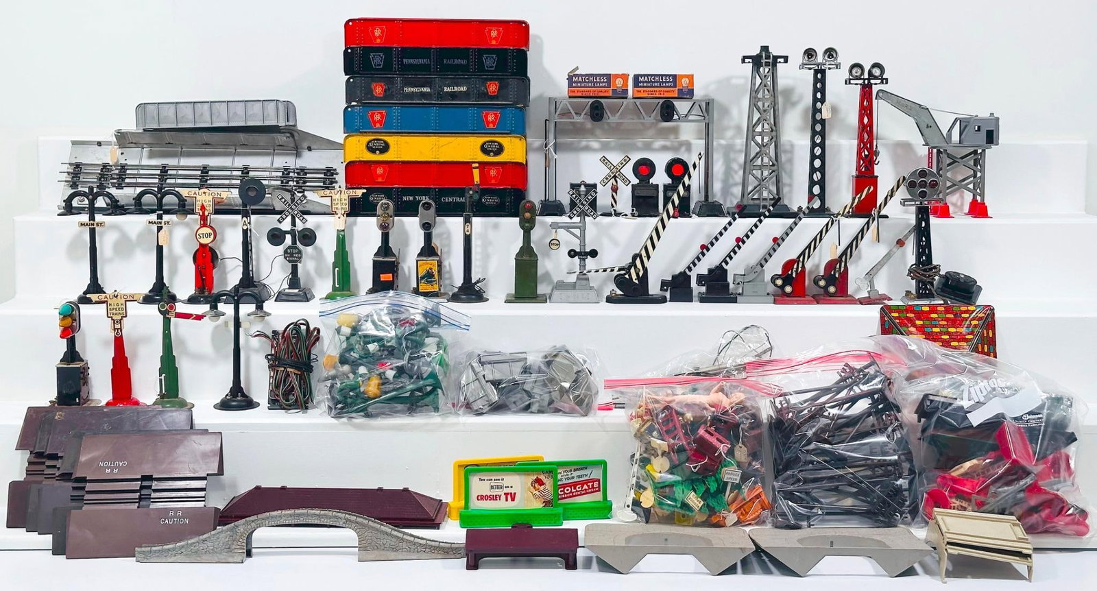 Marx Postwar O Gauge Gantry Crane-Assorted Floodlight Towers-Assorted Girder Bridges and Semaphores: Marx Postwar O Gauge Gantry Crane - Assorted Floodlight Towers - Assorted Girder Bridges - Assorted Semaphores and Railroad Crossing Signals, in C7 to C8. Due to the size and volume of this Lot, it wi