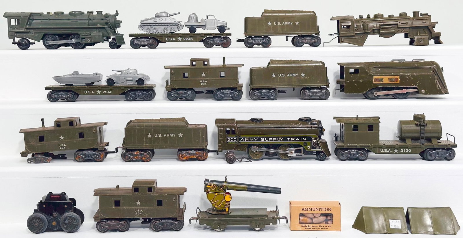 Marx Prewar and Postwar Commodore Vanderbilt Army Set: Marx Prewar and Postwar Commodore Vanderbilt Army Set, including Commodore Vanderbilt Locomotive in C6 minus, a 400 U.S. Army Locomotive shell only and U.S. Army Tender, with two (2) Army Flat Cars wi