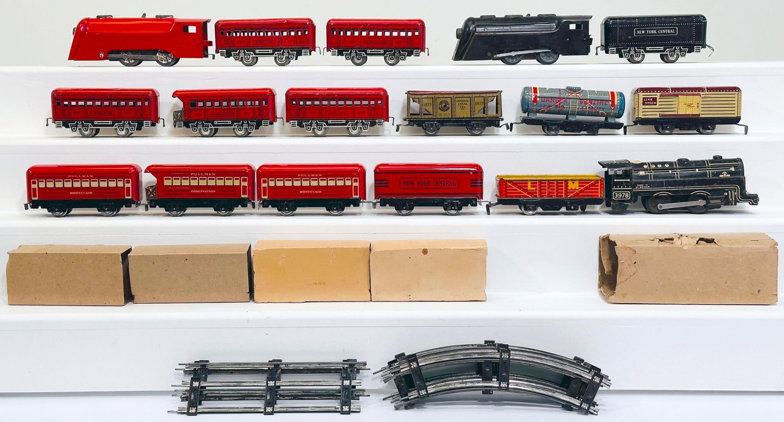 Marx Prewar and Postwar O Gauge Freight Cars/ Passenger Cars and red 0- 4-0 Locomotive/Four (4) Cars: Marx Prewar and Postwar O Gauge Freight Cars and Passenger Cars, and a red 0 - 4 - 0 Locomotive and Four (4) Passenger Cars, each in C7 plus or better. The black Locomotives and Tender and four (4) Pa