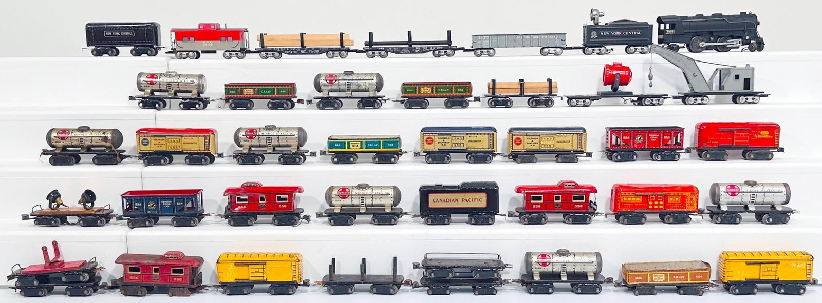 Marx Postwar O Gauge 999 Black Locomotive and New York Central Tender/Two (2) miscellaneous Tenders: Marx Postwar O Gauge 999 Black Locomotive and New York Central Tender/Two (2) miscellaneous Tenders/Thirty-Six (36) Assorted Freight Cars, each in C6 to C7. This is a General Condition Lot, meaning