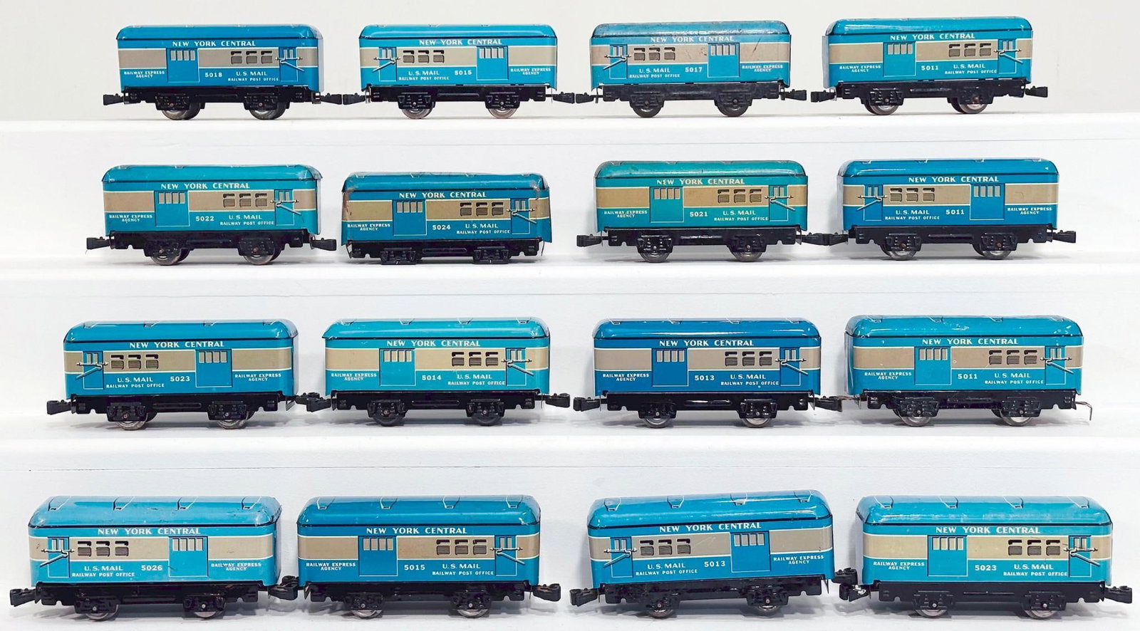 Marx Postwar O Gauge Sixteen (16) Assorted New York Central blue 4 Wheel Passenger Cars: Marx Postwar O Gauge Sixteen (16) Assorted New York Central blue 4 Wheel Passenger Cars, most in C7 minus, but some in C6 as indicated in the pictures. One car is missing both wheel sets.