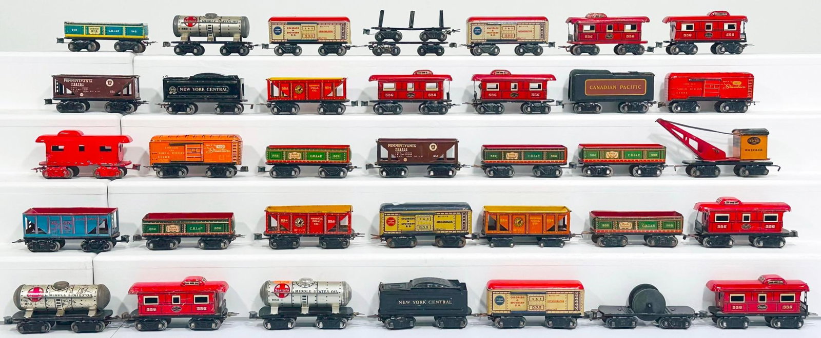 Marx Prewar and Postwar Assorted Three (3) Tenders and Thirty-three (33) Freight Cars: Marx Prewar and Postwar Assorted Three (3) Tenders and Thirty-three (33) Freight Cars, in C6 to C7. This is a General Condition Lot, meaning we have not graded or examined every item in the Lot so