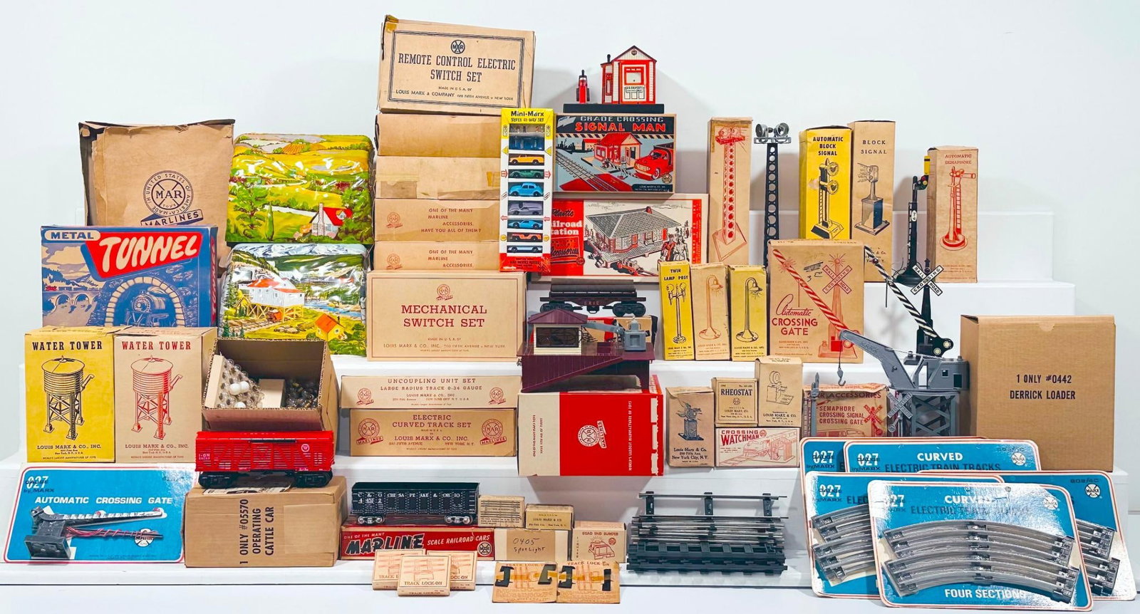Marx Postwar O Gauge Assorted Accessories: Marx Postwar O Gauge Assorted Accessories - Derrick Loader -Operating Cattle Car - Side Unloading Log Car - Bumper - Riostat - Gray Crossing Signal - Automatic Crossing Gate - Plastic Water Tower X2 -