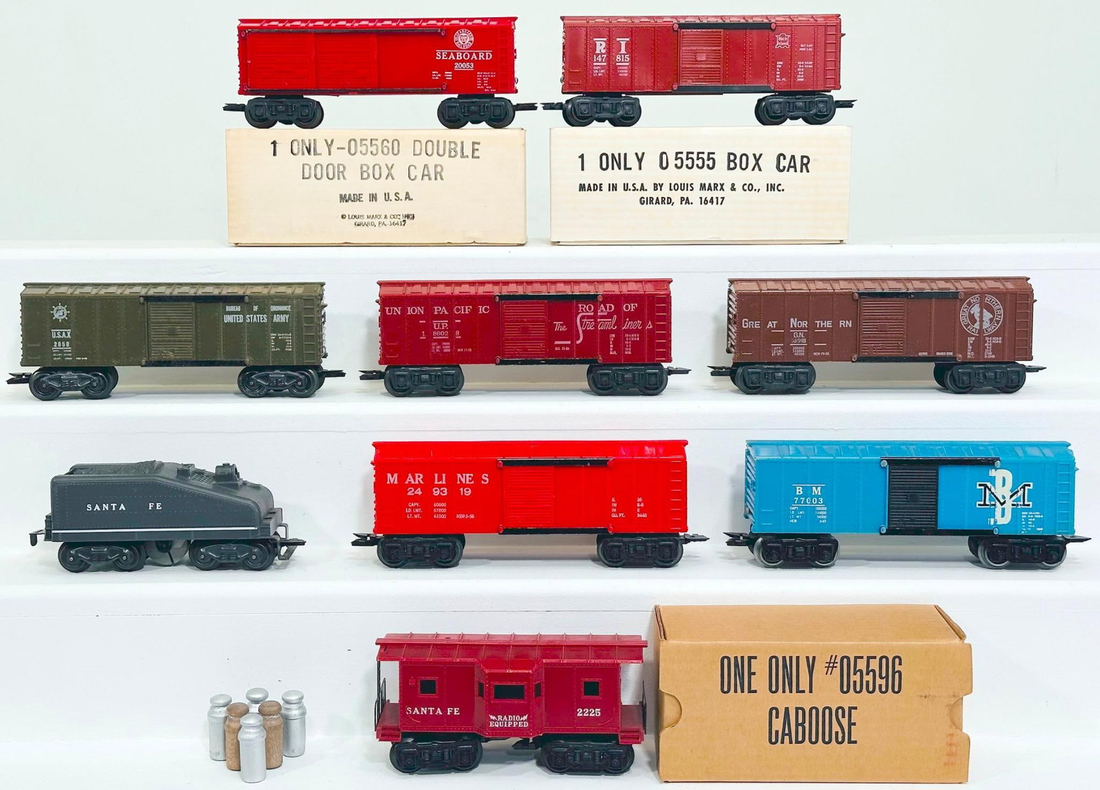 Marx Postwar O Gauge Nine (9) Assorted Freight Cars: Marx Postwar O Gauge Nine (9) Assorted Freight Cars, including Seaboard Box Car in C8 and with its original box, Rock Island Box Car in C8 and with its original box, Santa Fe Caboose in C8 and with it