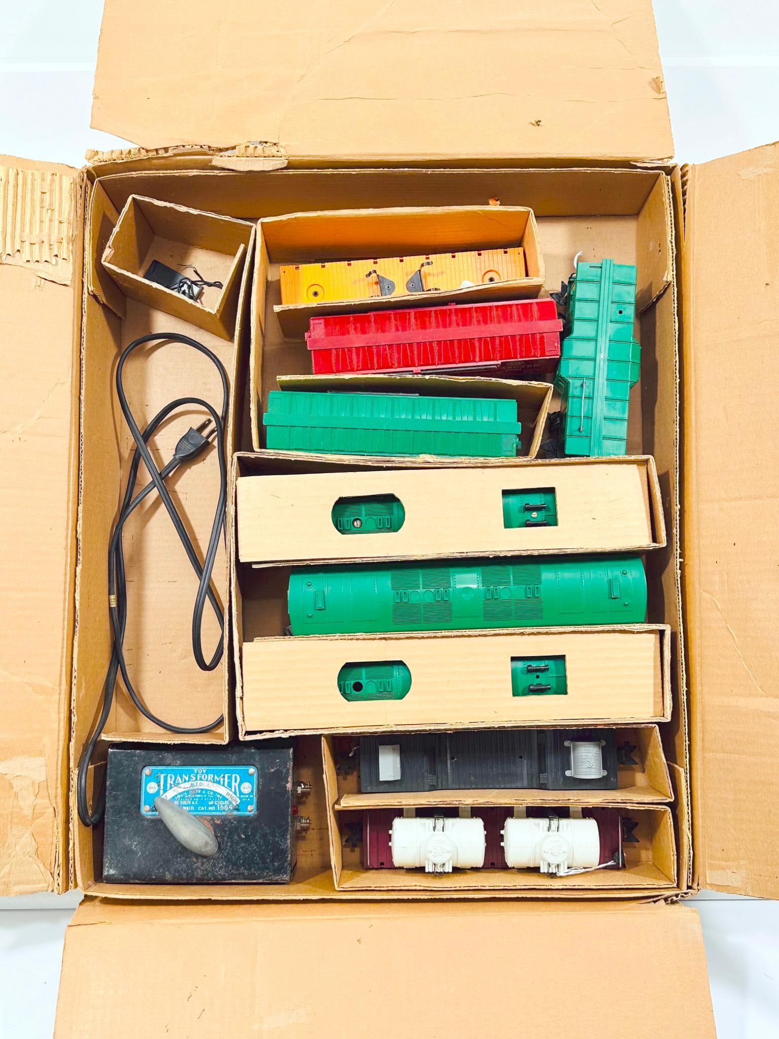 Marx Postwar O Gauge A - B - A Western Pacific Diesel Units and Six (6) Assorted Freight Cars Boxed: Marx Postwar O Gauge A - B - A Western Pacific Diesel Units and Six (6) Assorted Freight Cars Boxed, each in C7 and with its original Set Box No. 48925, showing moderate to heavy wear.