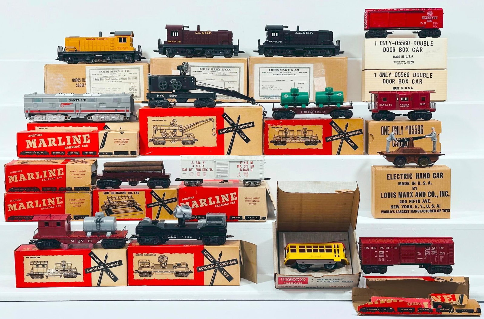 Marx Postwar O Gauge Assorted Freight Cars and Switchers Boxed: Marx Postwar O Gauge Assorted Freight Cars and Switchers Boxed, including Caboose in C8 and with its original box, Operating Crane Car in C8 and with its original box, 05560 Double Door Box Car Boxed 