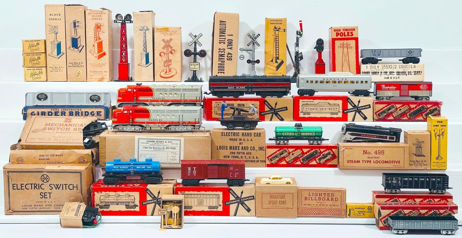 Marx Postwar O Gauge Assorted Accessories-Lights-Freight Cars - Hi- Tension Poles - Switches Boxed: Marx Postwar O Gauge Assorted Accessories - Lights - Freight Cars - Hi- Tension Poles - Switches Boxed, including Electric Circuit Breaker, Lighted Dead-End Bumper X3, Twin Light Crossing Flasher, Hi-