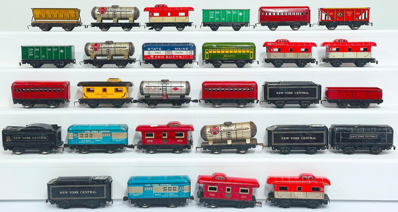 Marx of Prewar Postwar O Gauge Twenty-eight (28) Assorted Freight/Passenger Cars and Tenders: Marx of Prewar Postwar O Gauge Twenty-eight (28) Assorted Freight/Passenger Cars and Tenders, in C6 to C7. This is a General Condition Lot, meaning we have not graded or examined every item in th