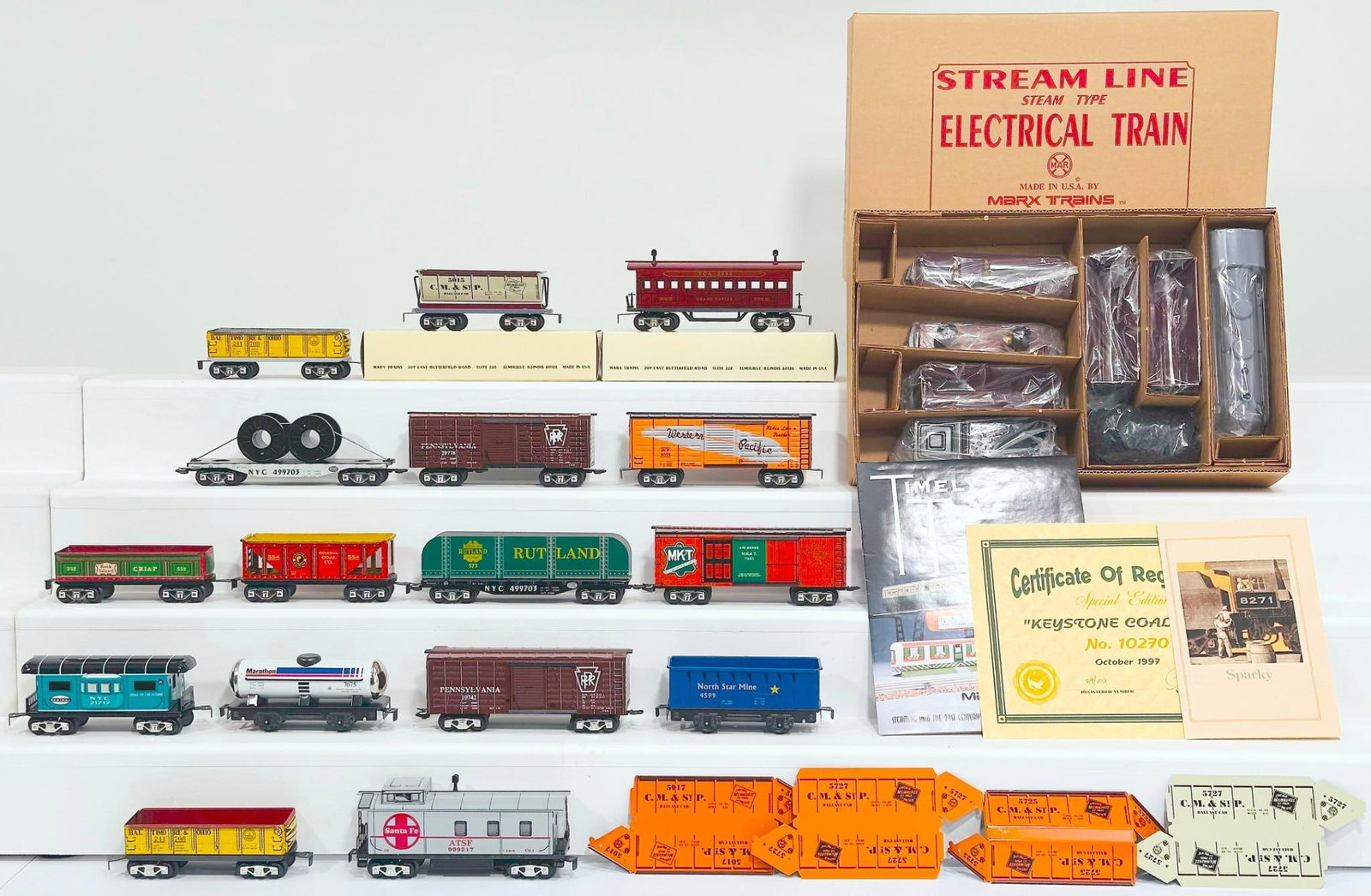 New Marx Modern O Gauge Sixteen (16) Assorted Freight Cars: New Marx Modern O Gauge Sixteen (16) Assorted Freight Cars, each in C8 and only two original boxes as noted in the pictures. This Lot also includes the Pennsylvania Railroad 0 - 4 - 0 Locomotive and T