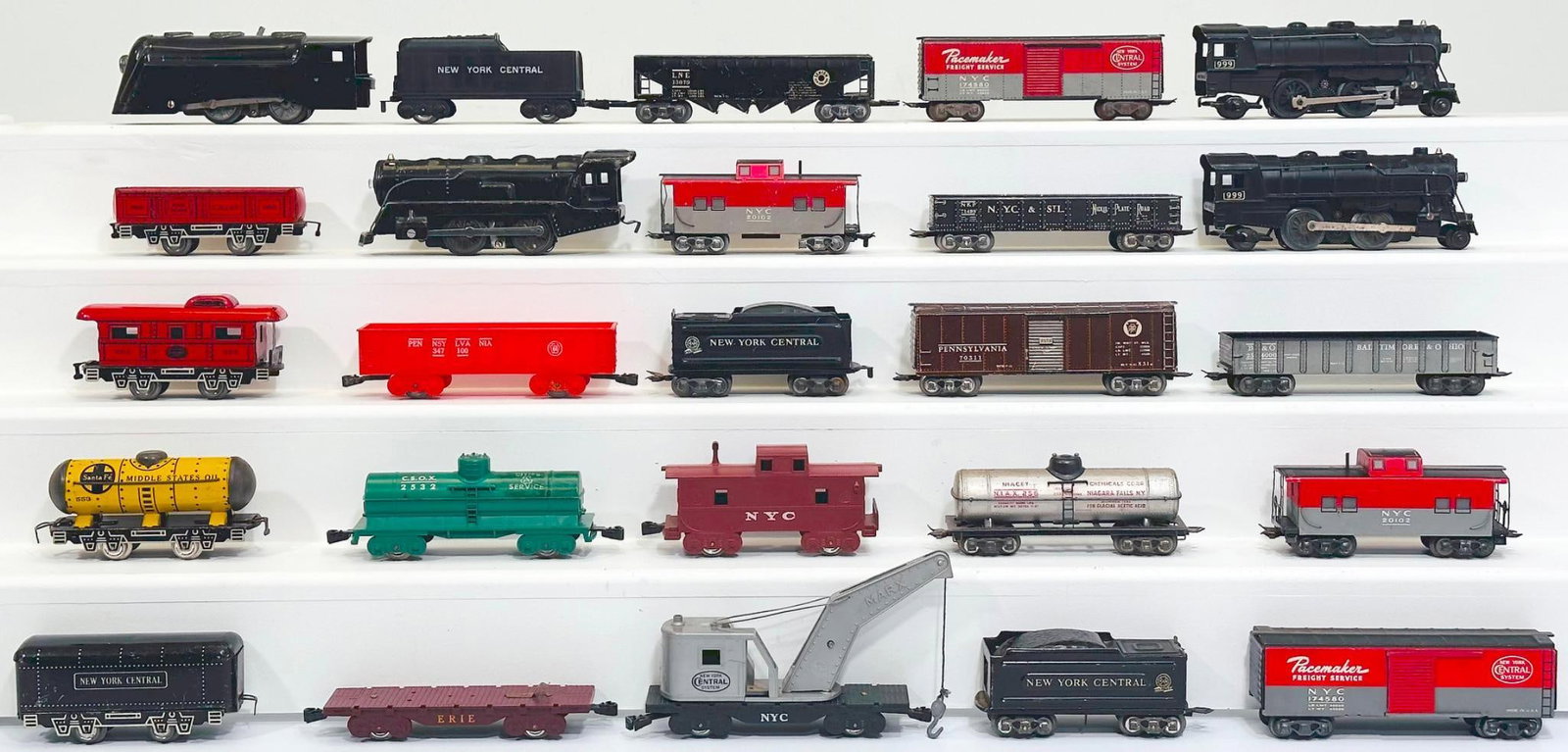 Marx Prewar and Postwar O Gauge 999 Locomotive and Tender X2/0 - 4 - 0 Locomotive and NYC Tender X2: Marx Prewar and Postwar O Gauge 999 Locomotive and Tender X2/0 - 4 - 0 Locomotive and New York Central Tender X2 and Assorted 4 Wheel and 8 Wheel Freight Cars, each in C6 or C7. This is a General