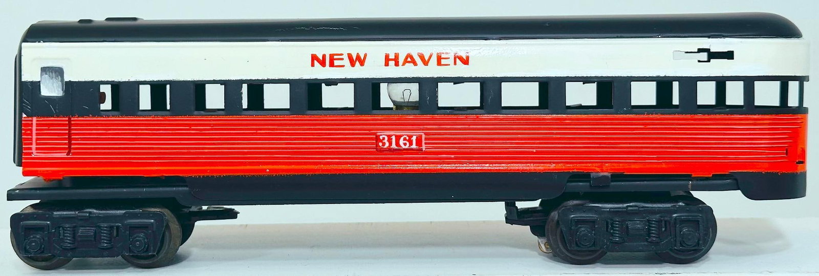 Marx Postwar O Gauge hand painted New Haven Factory Prototype Passenger Car: Marx Postwar O Gauge hand painted New Haven Factory Prototype Passenger Car, Model #2674 - A, dated January 10, 1961, in Girard, PA, in C7. Longest item in this Lot is 11 inches.